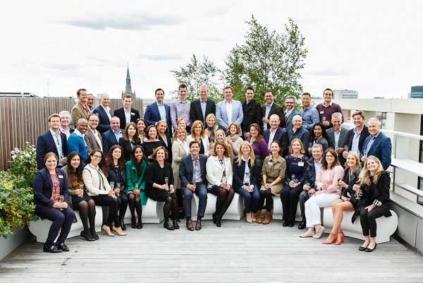 Group of staff pose for photograph